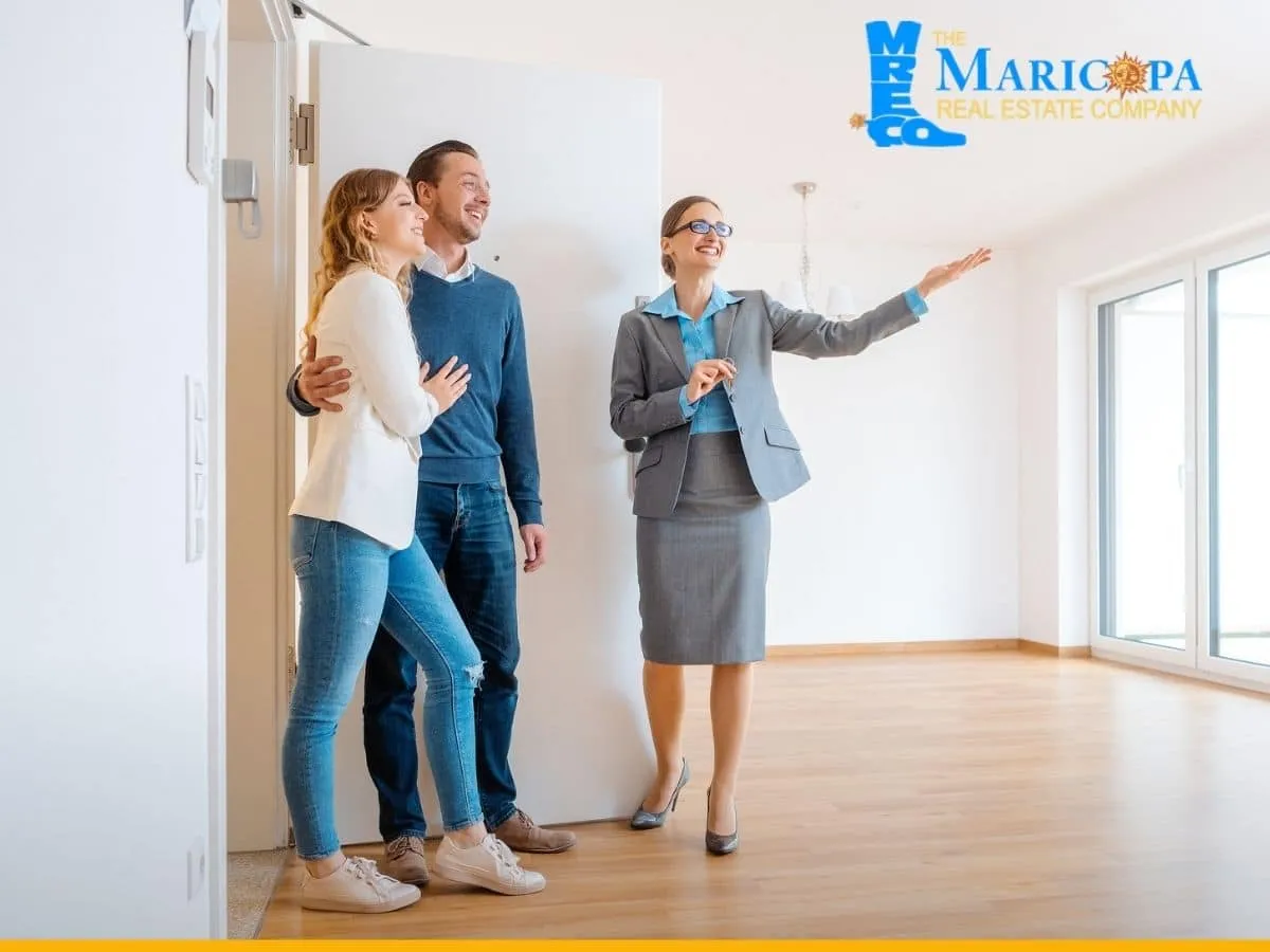 Realtor showing house to a young couple wanting to buying a property